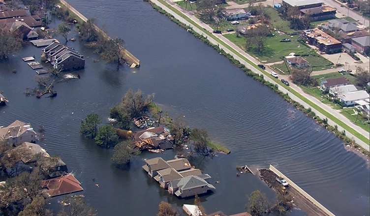 An aerial view of a broken levee after Hurricane Katrina. (Credit: National Geographic)
