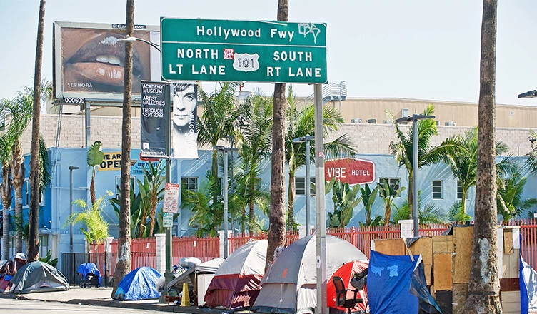 HOLLYWOOD CALIFORNIA - FEB. 26, 2022: Homeless encampment along the roadside depicting the ever growing epidemic of homelessness. Los Angeles. (Credit: Shutterstock)