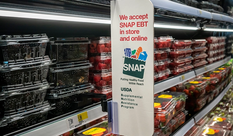 New York NY USA-October 8, 2024 A sign in a store in New York announces that the store accepts SNAP (Supplemental Nutrition Assistance Program) formerly known as EBT. (Credit: Shutterstock)