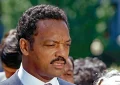 WASHINGTON DC, USA - JUNE 30, 1989 Reverend Jesse Jackson speaking to reporters in the West Wing driveway of the White House after attending the 25th anniversary event of the “Civil Rights Act” (Credit: Shutterstock)