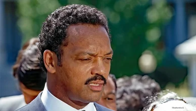 WASHINGTON DC, USA - JUNE 30, 1989 Reverend Jesse Jackson speaking to reporters in the West Wing driveway of the White House after attending the 25th anniversary event of the “Civil Rights Act” (Credit: Shutterstock)