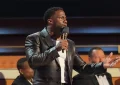 Kevin Hart speaks at the Tom Brady Roast (Credit: ADAM ROSE/NETFLIX)