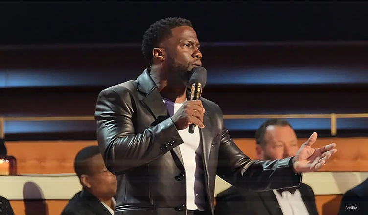 Kevin Hart speaks at the Tom Brady Roast (Credit: ADAM ROSE/NETFLIX)