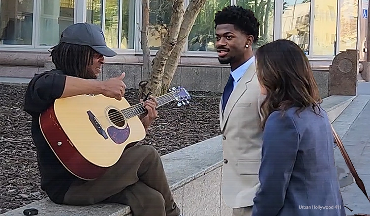 Thursday, March 12, 2026. Van Nuys, Los Angeles, California. Street musician Jensen Pawley played a song for Lil Nas X and his attorney Christy O’Connor outside the Van Nuys Courthouse in Los Angeles. (Credit: Anita Bennett/Urban Hollywood 411)