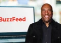 Byron Allen is shown in a composite image with the Buzzfeed logo on a computer. (Credit: Shutterstock)