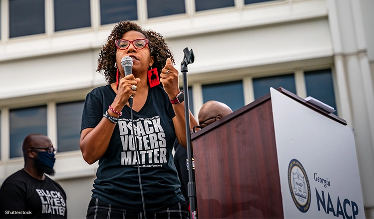 ATLANTA, GEORGIA / USA - June 15, 2020: Scenes from the NAACP-sponsored rally and march to the Georgia State Capitol, which focused on voting rights, police brutality, and criminal legal reform. (Credit: Shutterstock)