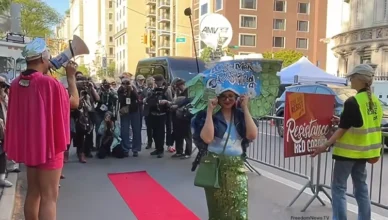 Protesters held a "resistance red carpet" event outside the Met Gala in New York City on Monday, May 4, 2026. (Credit: YouTube/FreedomNews.TV) Strike a Pose Outside Met Gala 2026