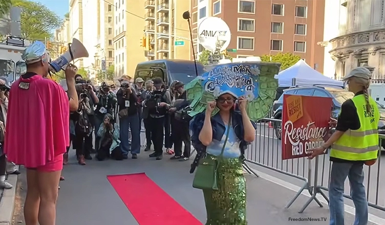 Protesters held a "resistance red carpet" event outside the Met Gala in New York City on Monday, May 4, 2026. (Credit: YouTube/FreedomNews.TV) Strike a Pose Outside Met Gala 2026