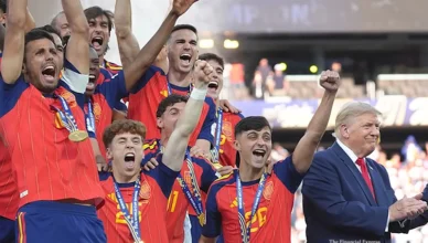 President Donald Trump lingered on the stage with Spain's national football at the 2026 World Cup trophy ceremony team on Sunday, July 19, 2026. (Credit: YouTube/The Financial Express)