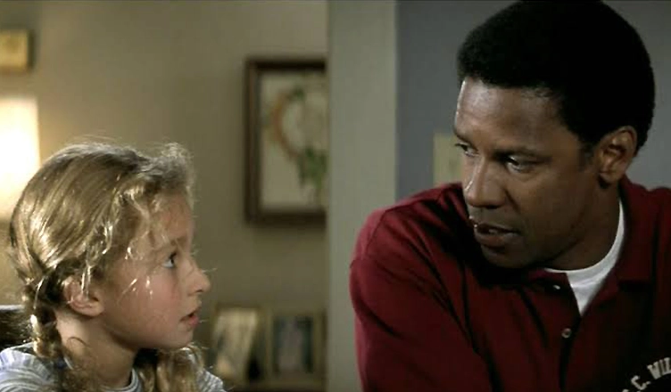 Hayden Panettiere with Denzel Washington in Remember the Titans. (Credit: Buena Vista Pictures)