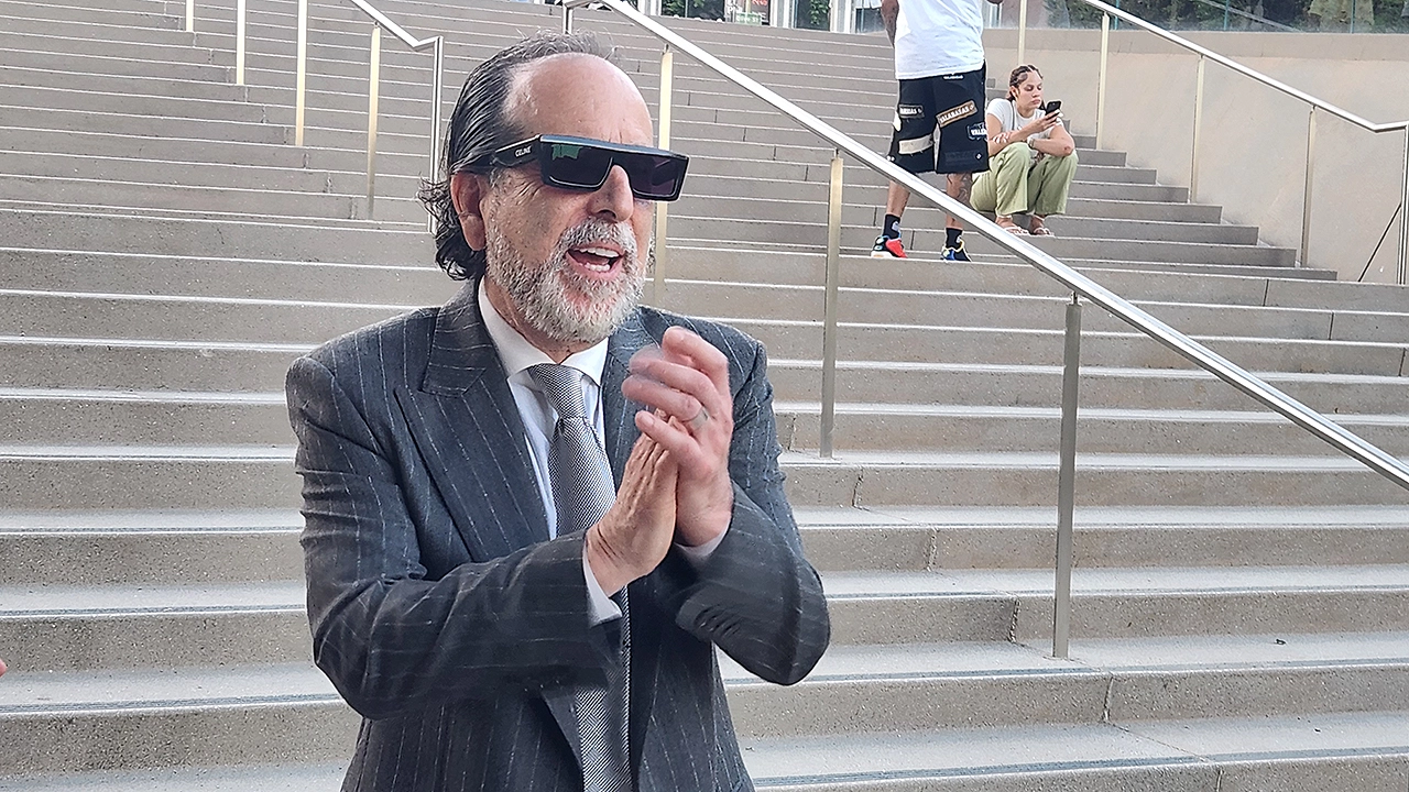 Lil Durk's lead attorney Drew Findling celebrates the rapper's not guilty verdict on the steps of the federal courthouse in Los Angeles on Friday, Sept. 11, 2026. (Credit: Anita Bennett/Urban Hollywood 411
