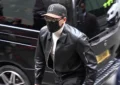 Chris Brown arrived at court in London dressed casually for the hearing in a black leather jacket, with a white turtleneck, black slacks, a baseball cap, a black face mask and dark shades on Monday, October 26, 2026. (Credit: Screengrab from YouTube/AFP)