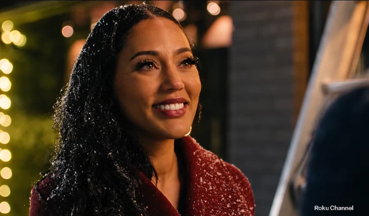 Ayesha Curry is heading home for the holidays — and hoping to leave a string of Christmas breakups behind — in the new romantic comedy Second Chance Holiday. (Credit: Roku Channel)
